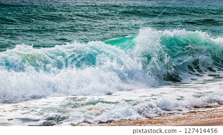 Waves crashing shore beach destination nature scene coastal environment close-up view serenity concept Waves crashing shore beach destination nature scene coastal environment close-up view serenity concept 127414456