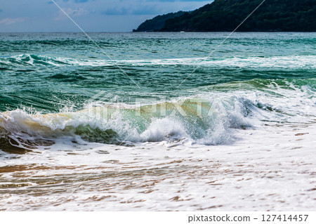 Waves crashing beach tropical coast nature scene serene environment coastal view oceanic beauty 127414457
