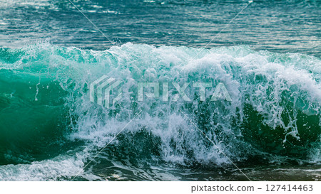 Waves crashing the shore beach nature coastal environment close-up view ocean power Waves crashing the shore beach nature coastal environment close-up view ocean power 127414463