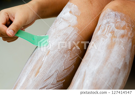 Body hair removal process home setting beauty routine indoor environment close-up view personal care Body hair removal process home setting beauty routine indoor environment close-up view personal care 127414547