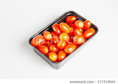 Harvesting fresh cherry tomatoes kitchen table food bright lighting top-down culinary delights Harvesting fresh cherry tomatoes kitchen table food bright lighting top-down culinary delights 127414604
