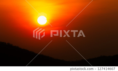 Sunset over mountains nature landscape peaceful evening scenic viewpoint 127414607