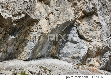 Mountain rock formation jagged cliffs boulder details Mountain rock formation jagged cliffs boulder details 127416358