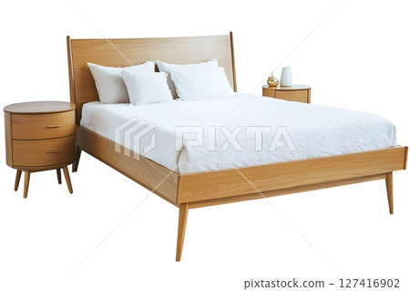 A wooden bed with a white comforter and pillows 127416902