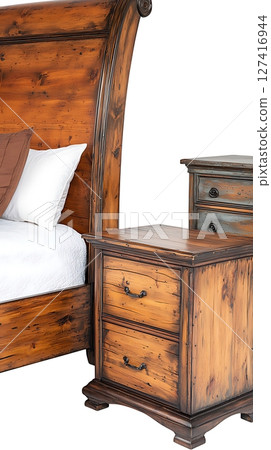 A wooden bed with a pillow and a white sheet 127416944