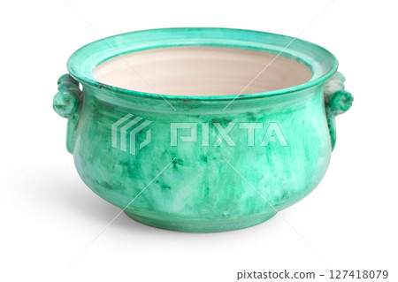 Empty green ceramic pot with handles and lid showing interior 127418079