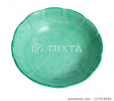 Empty green ceramic bowl with wavy edge on white background Empty green ceramic bowl with wavy edge on white background 127418089