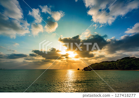 A dramatic sunset over the sea of Ishigaki Island 127418277