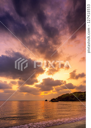 Ishigakijima sunset sky reflected in calm waves Romantic and quiet coast Ishigakijima sunset sky reflected in calm waves Romantic and quiet coast 127418553