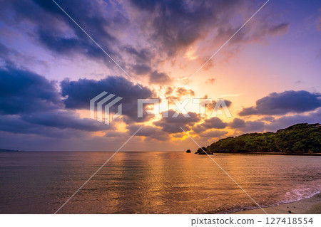 Ishigakijima sunset sky reflected in calm waves Romantic and quiet coast Ishigakijima sunset sky reflected in calm waves Romantic and quiet coast 127418554