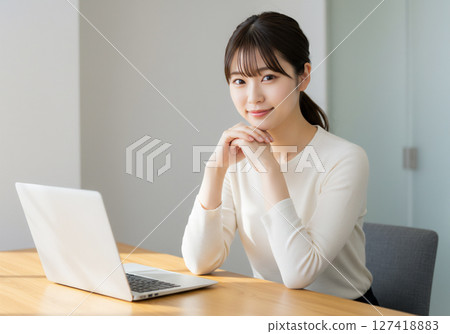 Business scene of a young woman working in the office 127418883