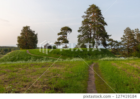 Rural summer landscape with an ancient Orthodox chapel. Savkina gorka 127419184