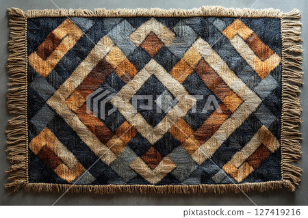 Handwoven rug texture with geometric print on a white background. Top view. 127419216