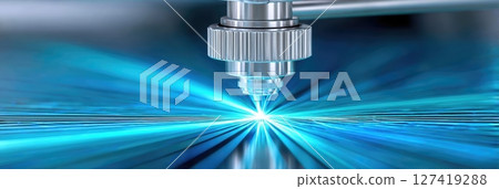 Laser technology creating precise designs with vibrant blue light in a manufacturing setup 127419288
