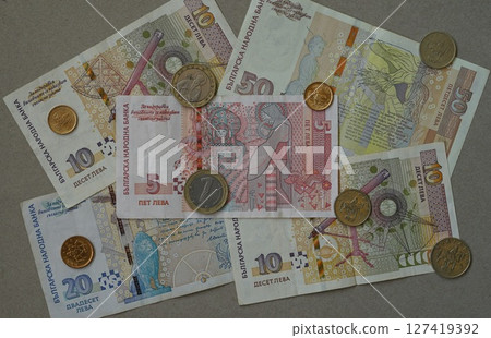 Bulgarian leva banknotes and coins arranged on neutral background. Bulgarian Levs. Bulgarian National Currency. Bulgarian National Bank 127419392