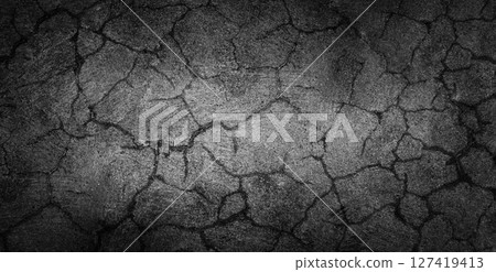 Cracked Black concrete Surface Texture. Grunge Background. Stock photo. Cracked Black concrete Surface Texture. Grunge Background. Stock photo. 127419413