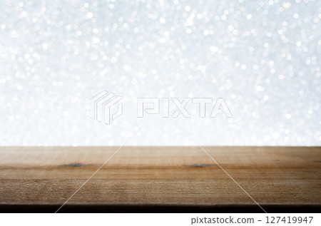 Wooden Table with White Bokeh Background. Festive Light Backdrop. Stock photo. Wooden Table with White Bokeh Background. Festive Light Backdrop. Stock photo. 127419947