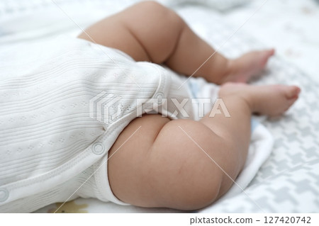 Plump legs of a 4-month-old baby 127420742