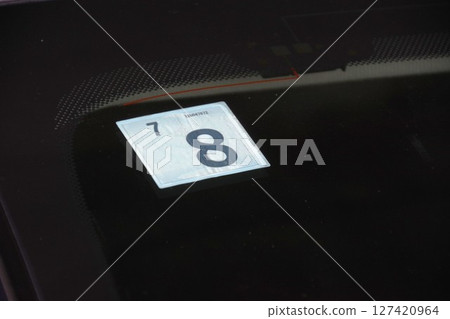 Vehicle inspection emblem on the windshield, with the Reiwa era name written on it Vehicle inspection emblem on the windshield, with the Reiwa era name written on it 127420964