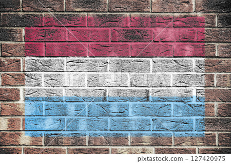 Luxembourg flag on brick wall background Luxembourg flag on brick wall background 127420975