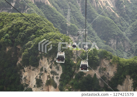 Cable car is used to travel from the bottom to the top of Yuntaishan Park is the most beautiful geological park in Henan Province, China. 127421570