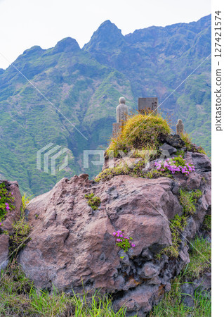 (Kumamoto Prefecture) Jizo statue overlooking Mt. Nekodake, Mount Aso, Sensuikyo 127421574