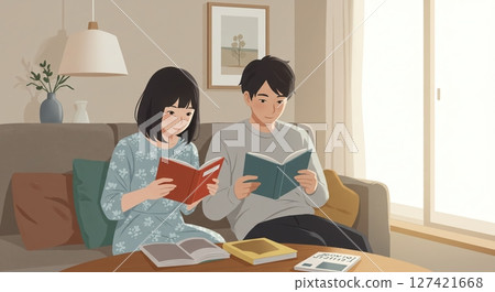 A couple enjoying a peaceful moment together reading on the sofa A couple enjoying a peaceful moment together reading on the sofa 127421668