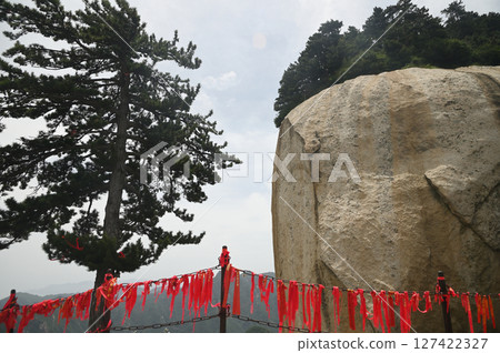 The walkway railings in the temple area have red Yantra tied to them at of Huashan Mountain is one of the most famous tourist attractions in China. The walkway railings in the temple area have red Yantra tied to them at of Huashan Mountain is one of the most famous tourist attractions in China. 127422327
