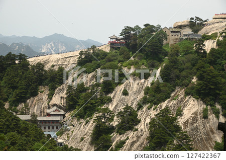The Taoist temple is located on Mount Huashan, an important religious site and one of the most famous tourist attractions in China. 127422367