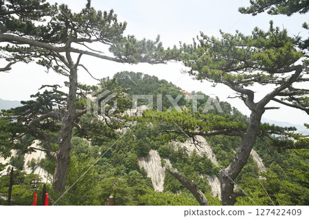 Mount Huashan is one of the most famous tourist attractions in China and one of the must-do activities is rock climbing and hiking. It is a sacred mountain, home to many deities. 127422409
