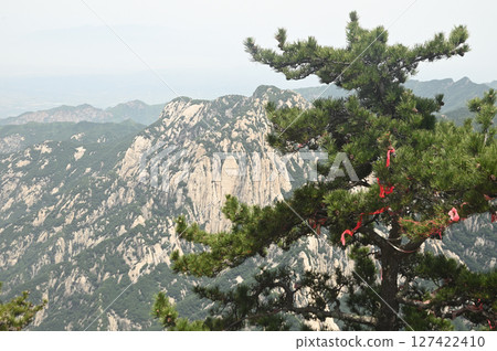 Mount Huashan is one of the most famous tourist attractions in China and one of the must-do activities is rock climbing and hiking. It is a sacred mountain, home to many deities. 127422410