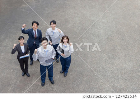Group photo of company employees standing outside 127422534