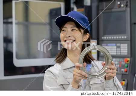 workers working in a factory workers working in a factory 127422814