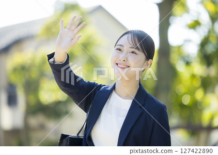 Young woman in a suit 127422890