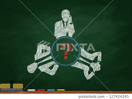 Silhouette illustration of businessmen working in a group around a round table drawn with chalk on a blackboard Silhouette illustration of businessmen working in a group around a round table drawn with chalk on a blackboard 127424265