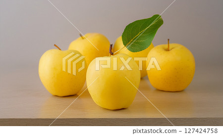 yellow apples with green leaves 127424758