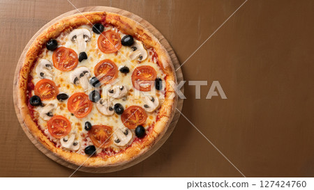 pizza on wooden board 127424760