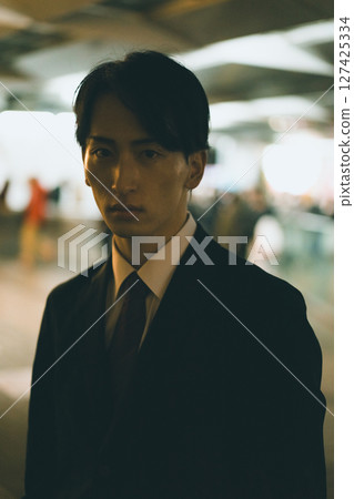 An office worker who had to work overtime and return home late at night An office worker who had to work overtime and return home late at night 127425334