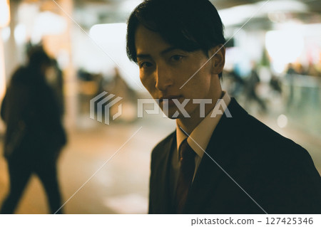 A salaryman hurrying home 127425346