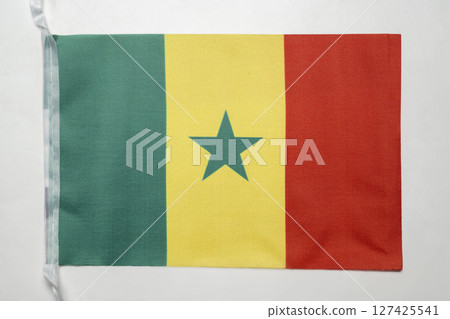 Closeup view of the Senegal national flag isolated over a white background. Concept of government and nationality 127425541