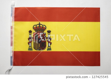Closeup view of the Spain national flag isolated over a white background. Concept of government and nationality 127425545