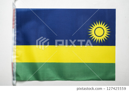 Closeup view of the Rwanda Republic national flag isolated over a white background. Concept of government and nationality 127425559