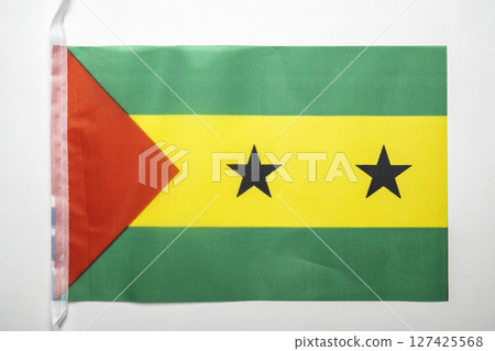 Closeup view of the Sao Tome and Principe national flag isolated over a white background. Concept of government and nationality Closeup view of the Sao Tome and Principe national flag isolated over a white background. Concept of government and nationality 127425568