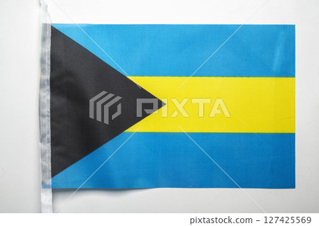 Closeup view of the Bahamas national flag isolated over a white background. Concept of government and nationality Closeup view of the Bahamas national flag isolated over a white background. Concept of government and nationality 127425569