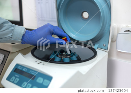 Scientist checking quality of medicine in the modern inspection laboratory in a medicine production factory Scientist checking quality of medicine in the modern inspection laboratory in a medicine production factory 127425604