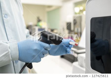 Scientist checking quality of medicine in the modern inspection laboratory in a medicine production factory 127425611