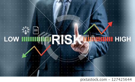 Businessman touching risk assessment icon. Technology innovation on a virtual screen. Concept of risk management Businessman touching risk assessment icon. Technology innovation on a virtual screen. Concept of risk management 127425644