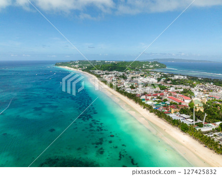 Scenic landscape of Boracay beaches with white sands and turquoise water and waves. Island in Philippines. Scenic landscape of Boracay beaches with white sands and turquoise water and waves. Island in Philippines. 127425832