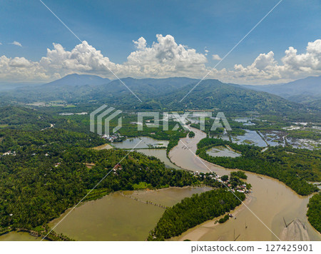 Agricultural land and Fish Farm under blue sky and clouds. Mindanao, Philippines. 127425901