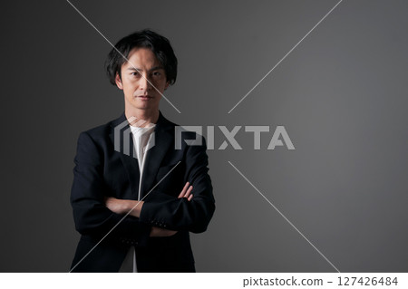 Businessman with arms folded Businessman with arms folded 127426484